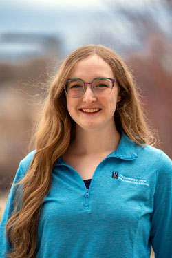 Young woman wearing glasses and smiling