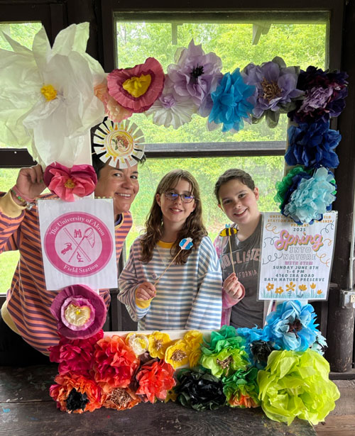 mother and two children smiling at camera