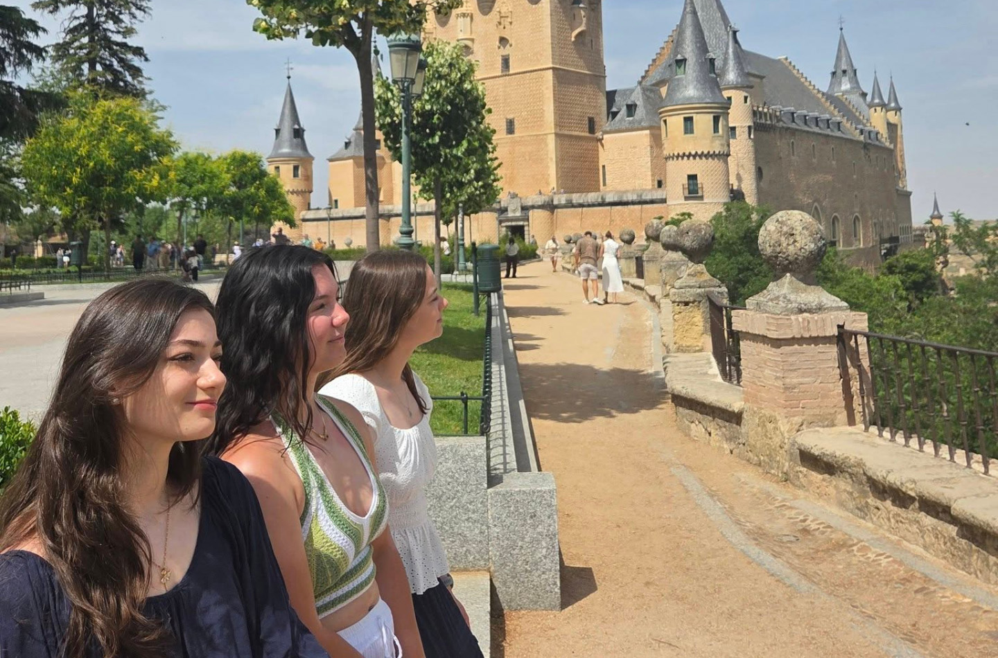 Students posing near a castle