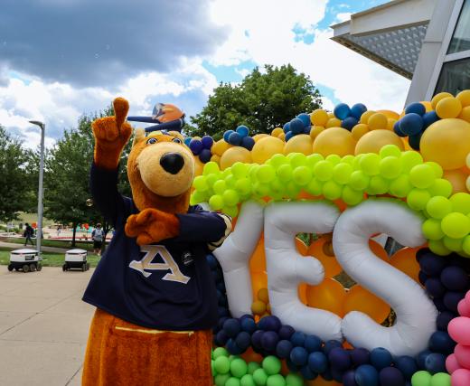 Zippy standing to yes balloons