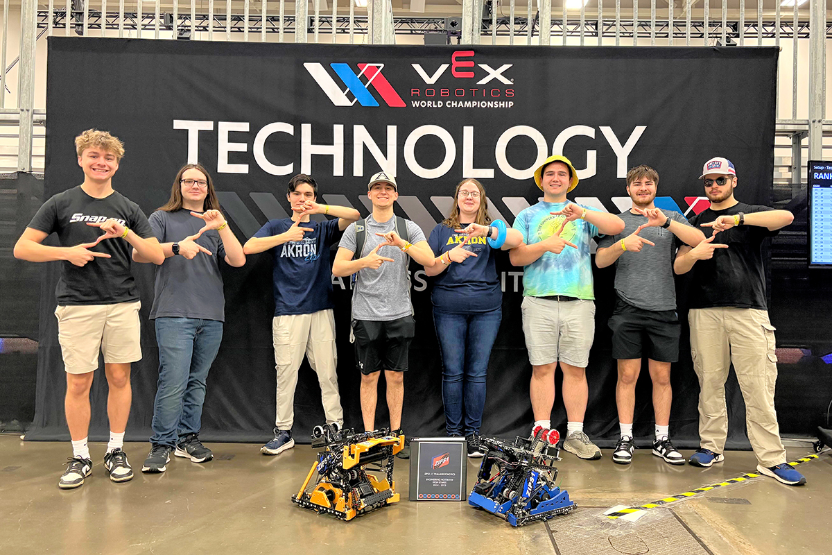 Phalanx Robotics team members stay energized after successfully passing inspection at the VEX Robotics World Championship in Dallas.