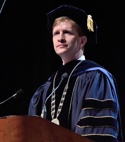 Matt Wilson at podium at commencement Matt Wilson at podium at commencement